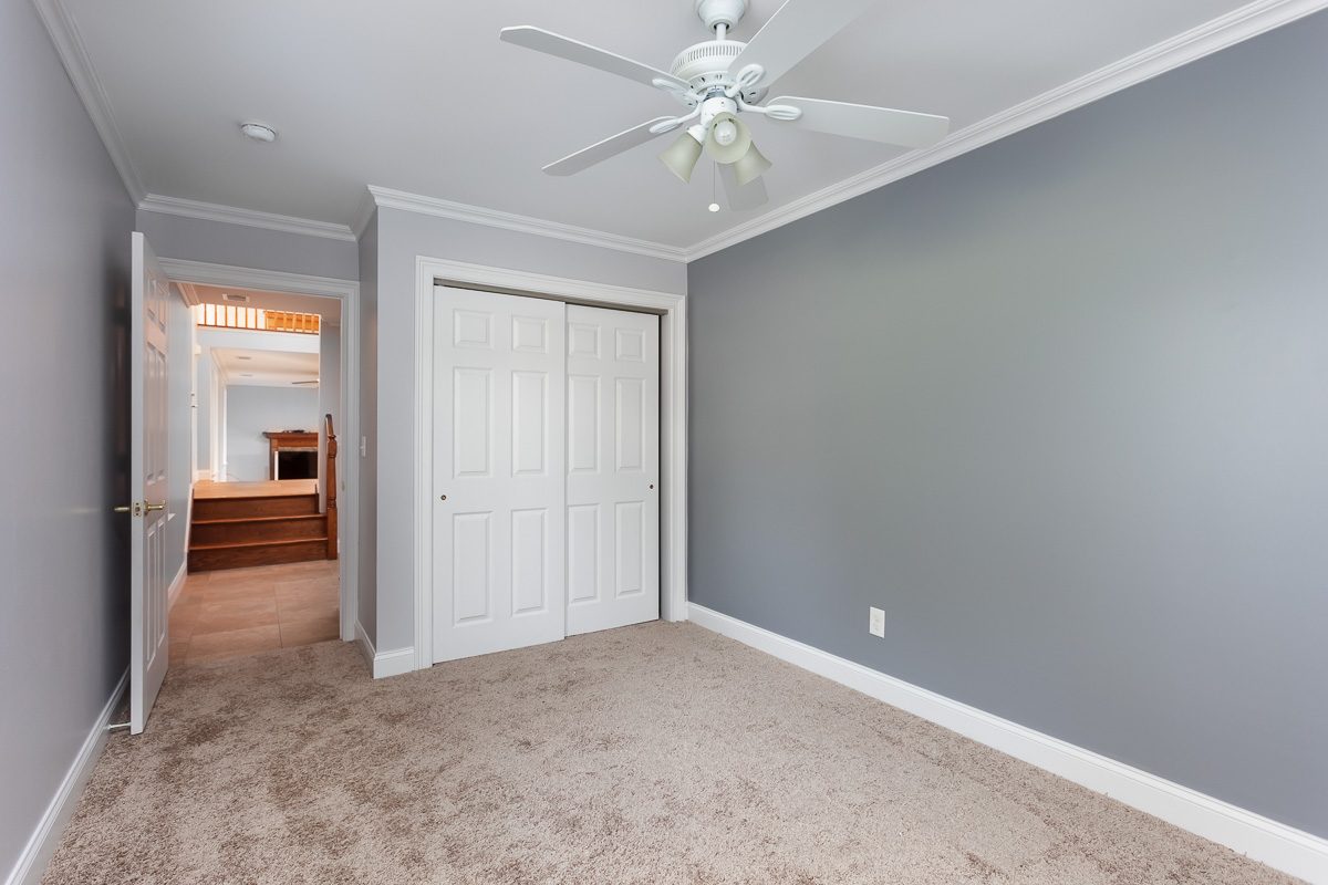Bedroom finished in a soft blue-gray