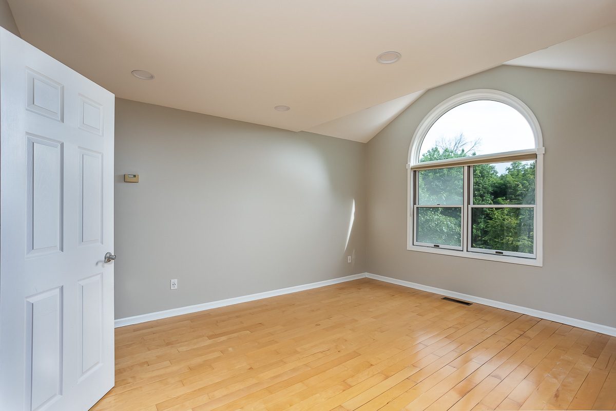 Bonus room with arched window repainted
