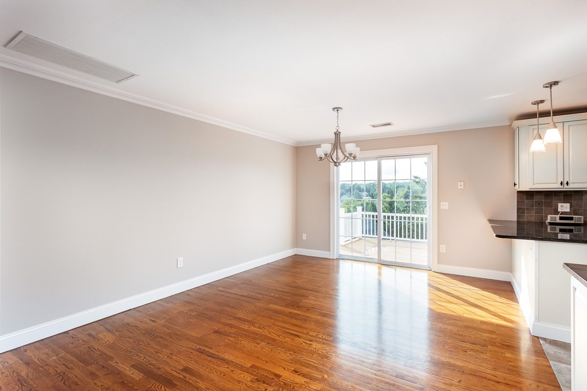 Open-concept living and kitchen area after interior painting in Monroe, NY