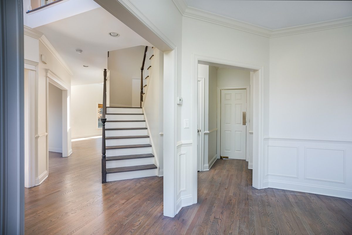 Entry hall and stairwell trim painted in a Warwick, NY colonial