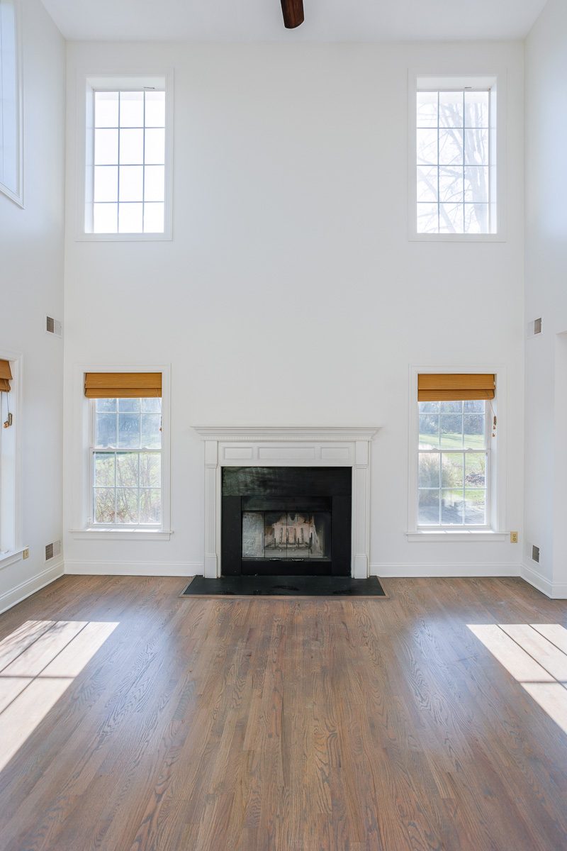 Two-story fireplace wall painted from staging in a Warwick, NY home